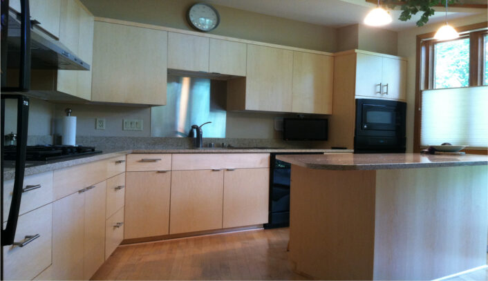 Contemporary kitchen remodel done with cabinet refacing