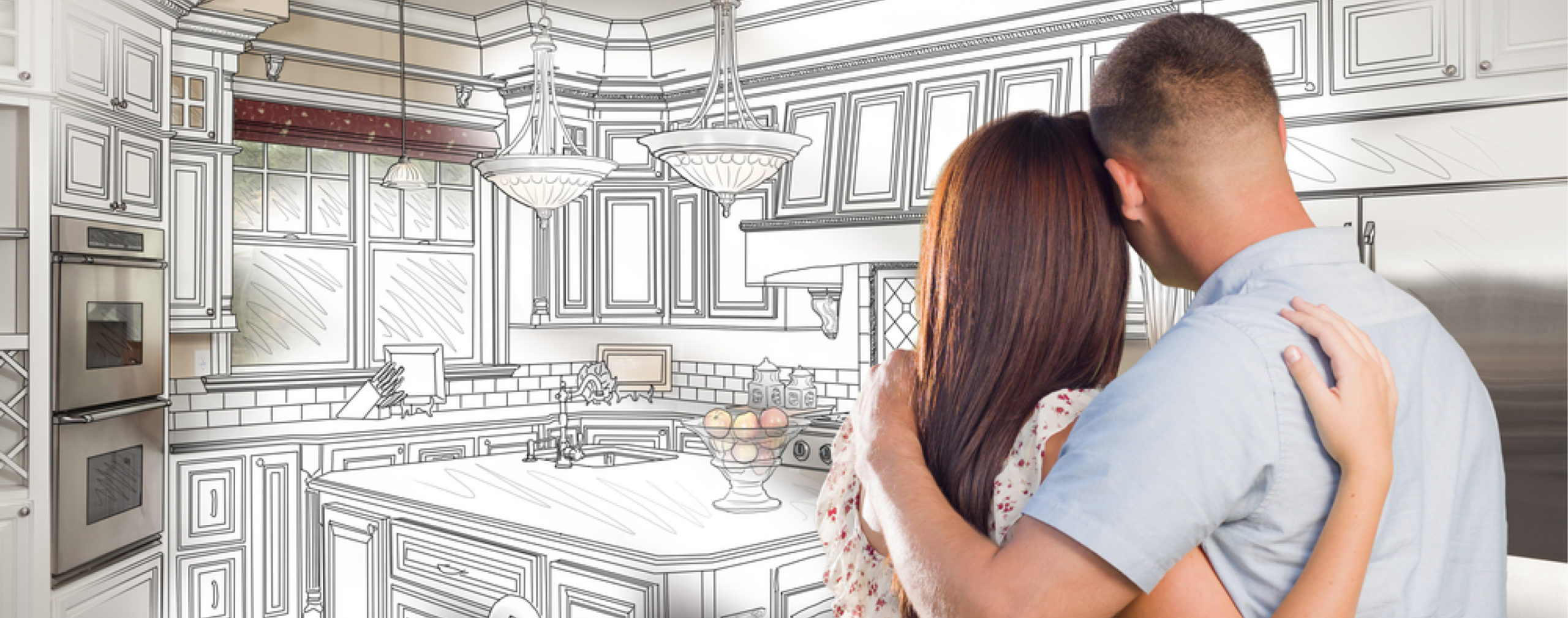 couple looking at a sketch of their kitchen design